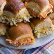 green and red Chicken Enchilada Sliders on a platter